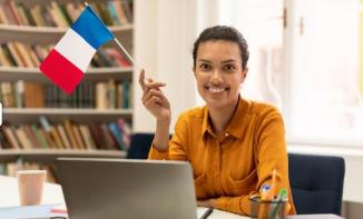 We can see a woman with a French flag to show HAPPY IN FRANCE offers French lessons in Colomiers